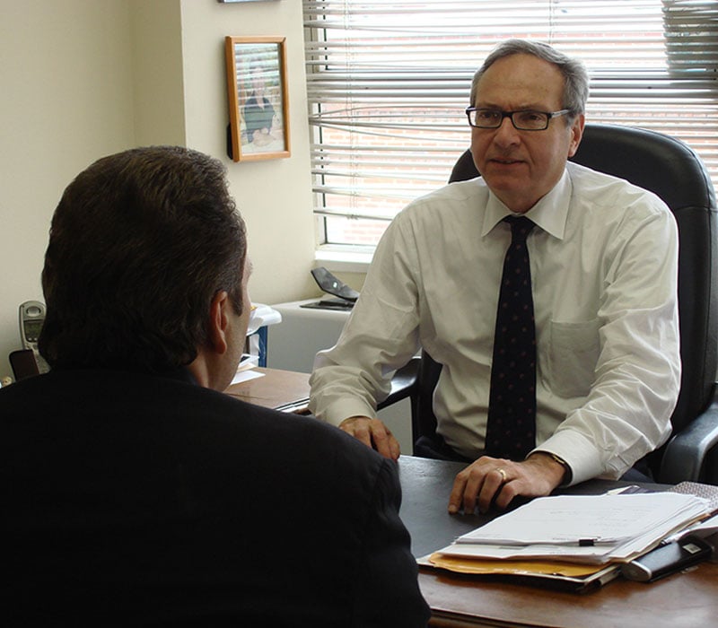Attorney Randy S. Alpert in consultation with a client